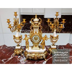 ساعت و شمعدان روی کنسول لاکچری ساعت و شمعدان روی کنسول لاکچری